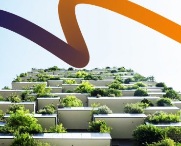 a tall building with lots of trees on top of it