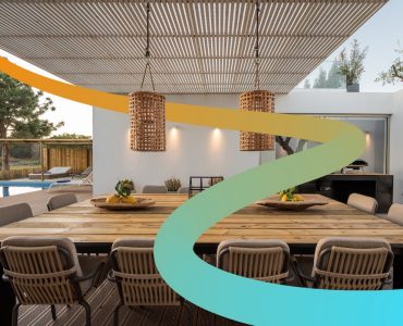 a dining room with a table and chairs next to a swimming pool