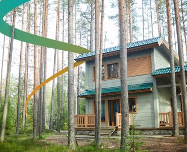 a house in the woods surrounded by tall trees