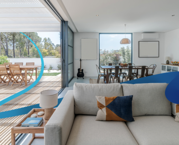 a living room filled with furniture and a large window