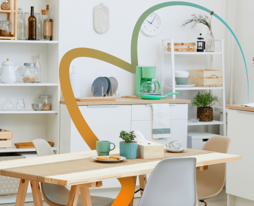 a kitchen with a table and chairs in it