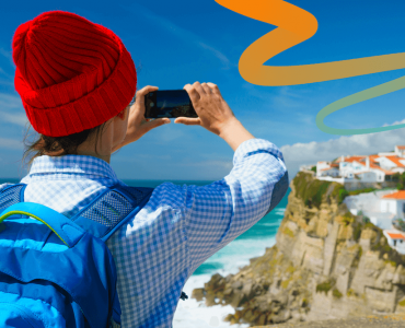 a person taking a picture with a cell phone