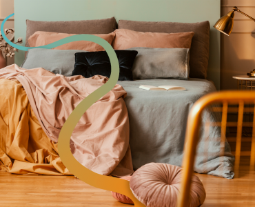 a bedroom with a bed and a chair