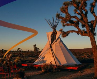 a teepee sitting in the middle of a desert