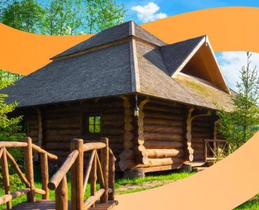 a log cabin with a wooden bridge leading to it