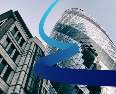 a tall building with a blue ribbon in front of it