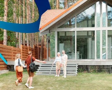 a group of people standing in front of a house