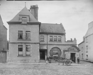 an old black and white photo of a building