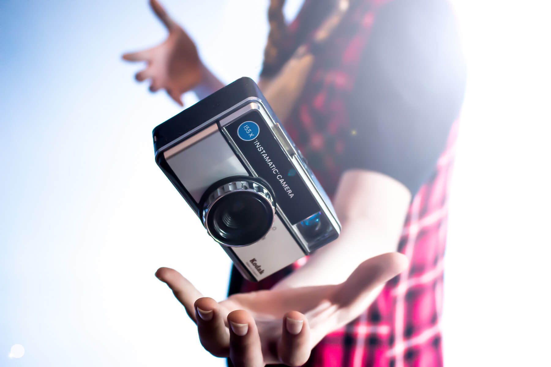 a person holding a camera in their hands