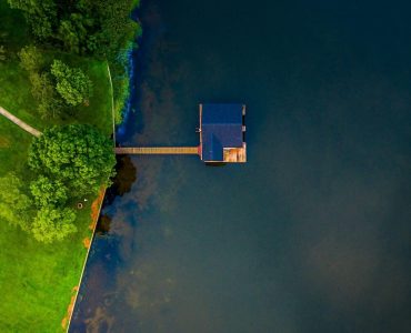 an aerial view of a house on a dock
